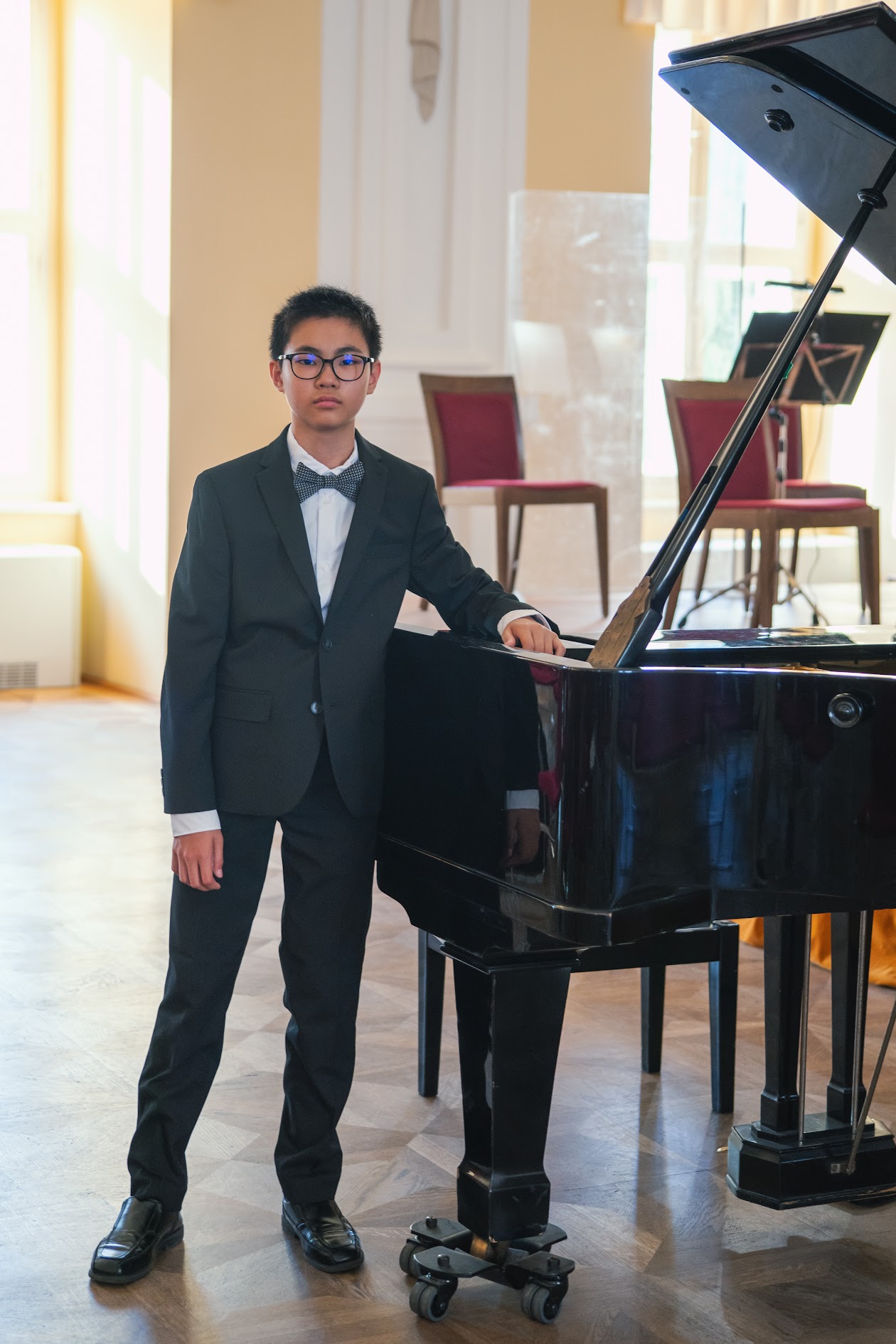Titus Lam by the Grand Piano